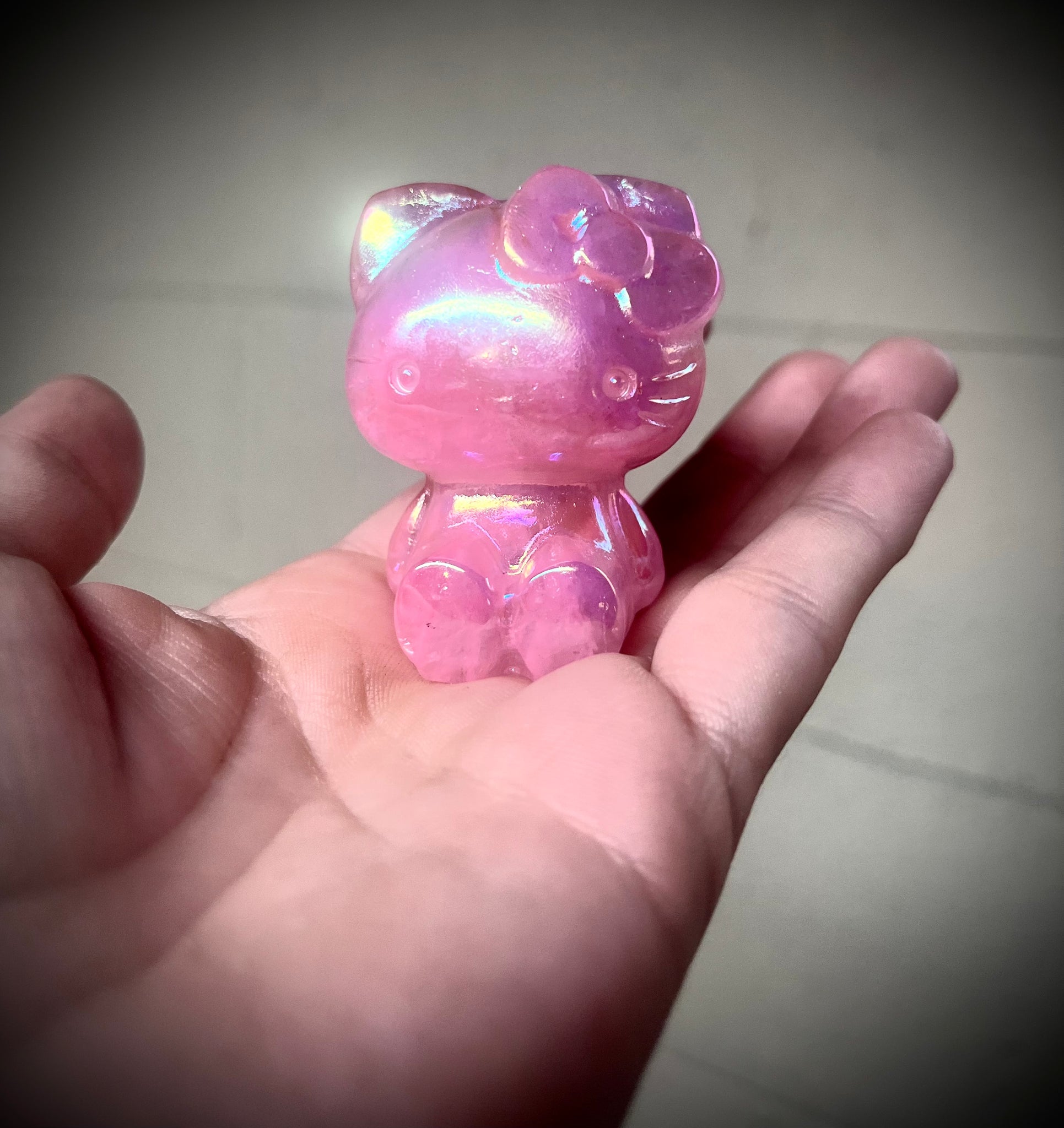 Rose quartz aura coated hello kitty carving