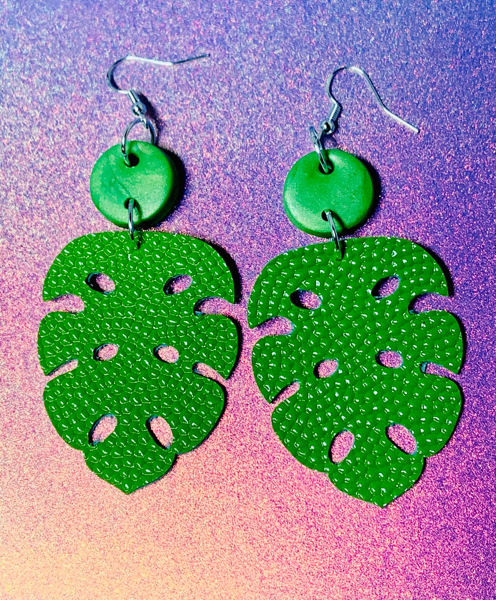 Green monstera leaf dangles